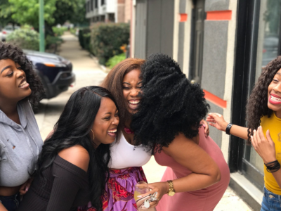 group of black women laughing
